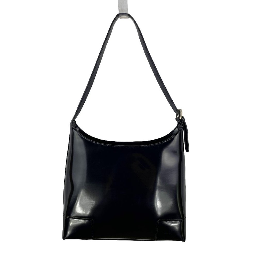 Shiny black structured shoulder bag with feet & adjustable strap